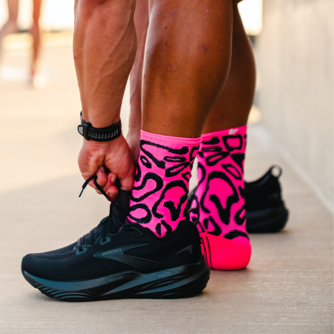 Image of person wearing Lightfeet Performance Scribbles Pink Black Crew Socks