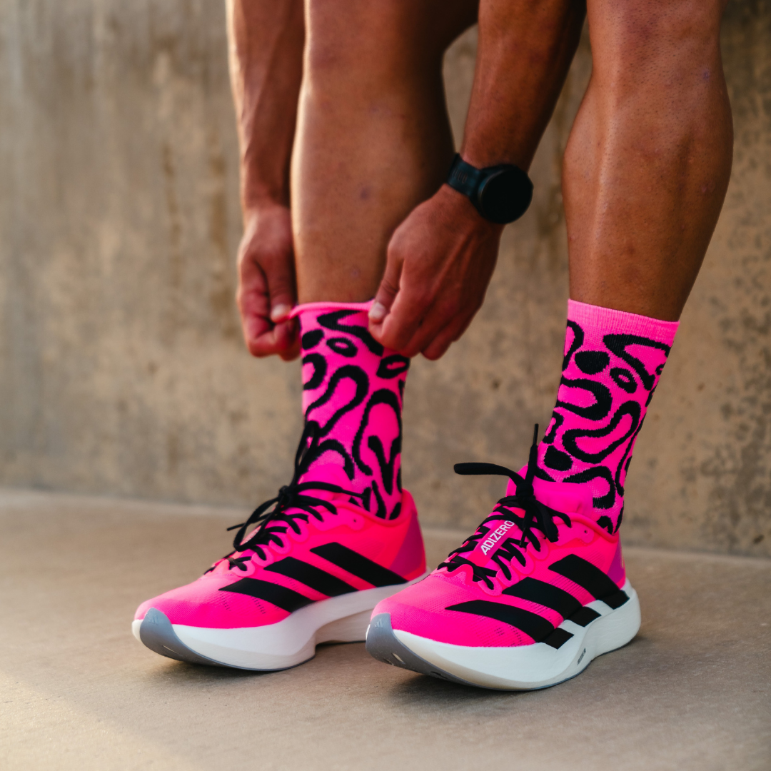 Image of person wearing Lightfeet Performance Scribbles Pink Black Crew Socks