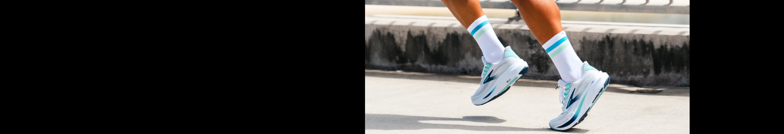Female runner on boardwalk by ocean