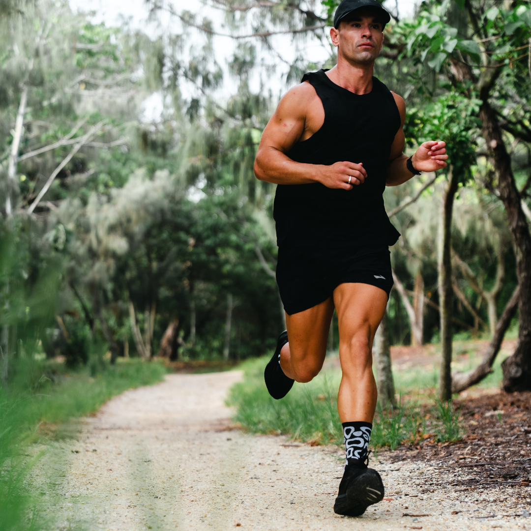 Image of person wearing Lightfeet Performance Scribbles Black White Crew Socks 