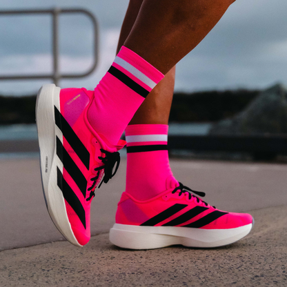 Image of person wearing Lightfeet Performance 2 Stripes Pink White BlackCrew Socks 