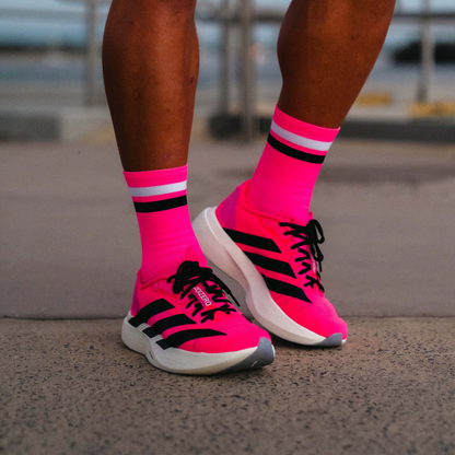 Image of person wearing Lightfeet Performance 2 Stripes Pink White BlackCrew Socks 