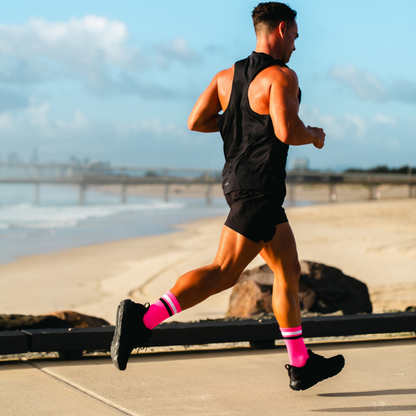 Image of person wearing Lightfeet Performance 2 Stripes Pink White BlackCrew Socks 