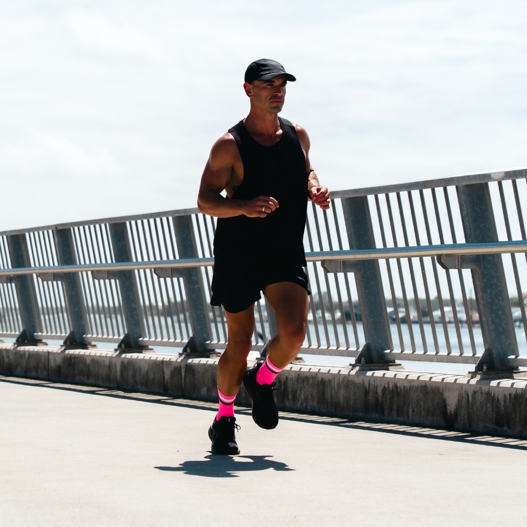 Image of person wearing Lightfeet Performance 2 Stripes Pink White BlackCrew Socks 