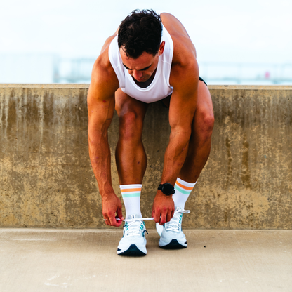 Image of person wearing Lightfeet Performance 2 Stripes White Coral Glacier Crew Socks 