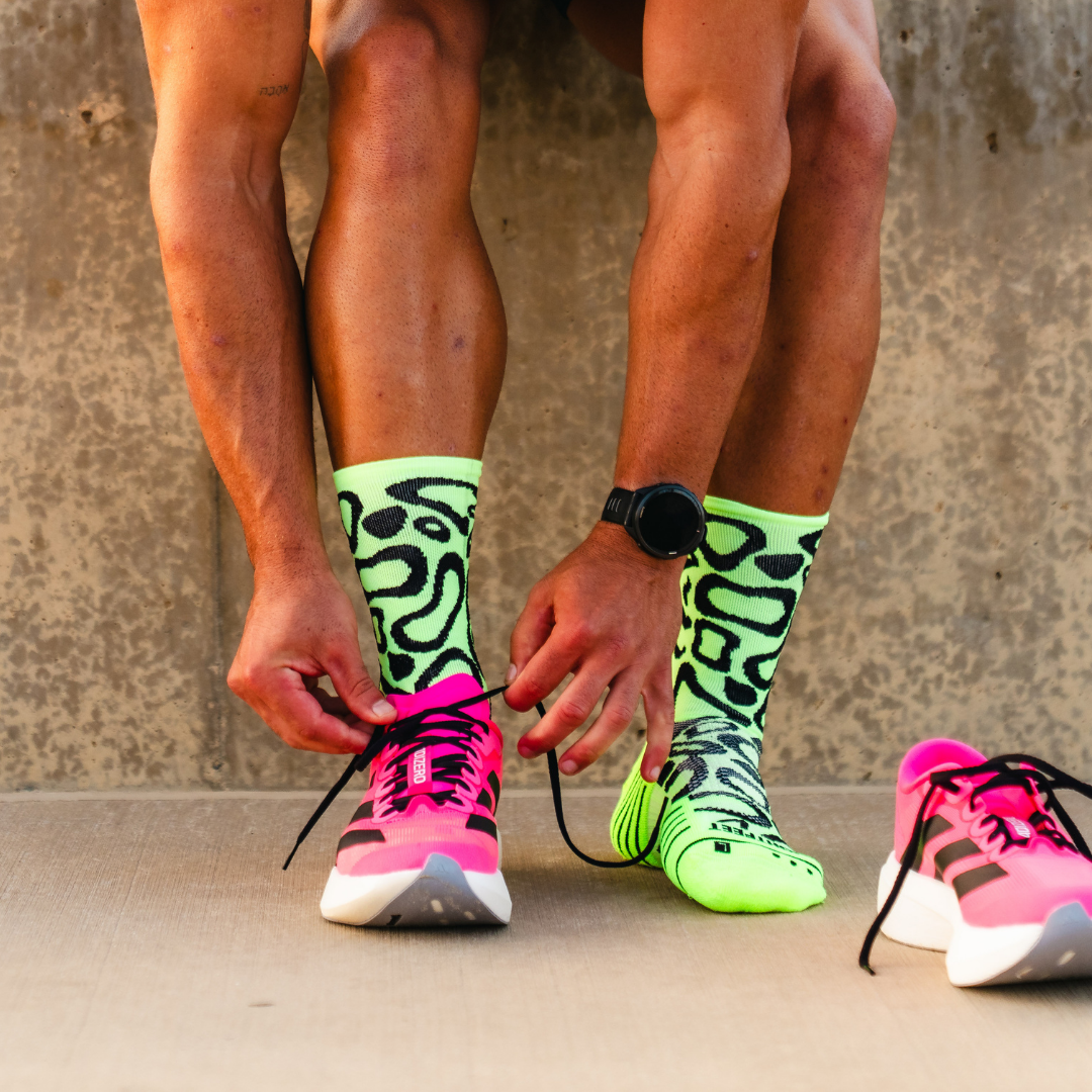 Image of person wearing Lightfeet Performance Scribbles Yellow Black Crew Socks 