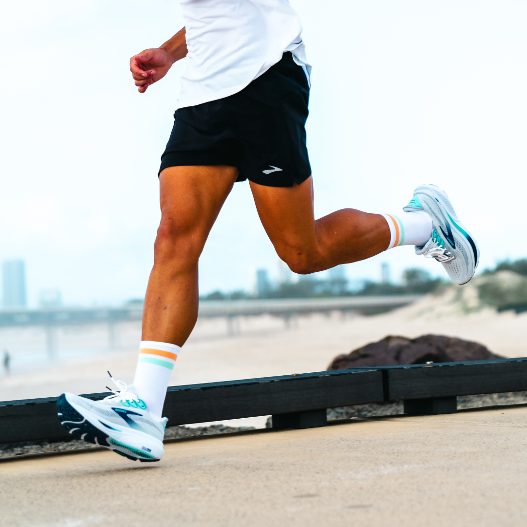 Image of person wearing Lightfeet Performance 2 Stripes White Coral Glacier Crew Socks 