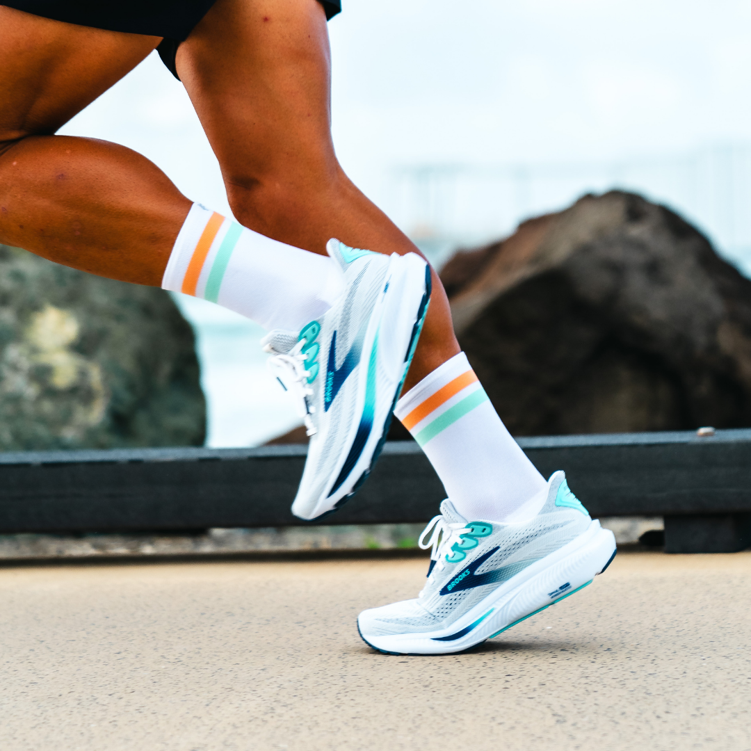 Image of person wearing Lightfeet Performance 2 Stripes White Coral Glacier Crew Socks 