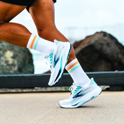 Image of person wearing Lightfeet Performance 2 Stripes White Coral Glacier Crew Socks 