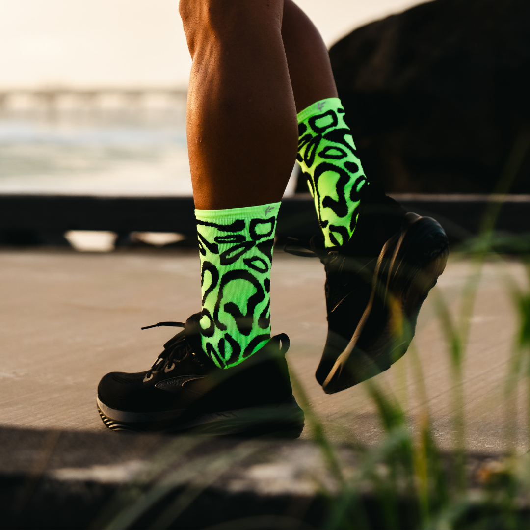 Image of person wearing Lightfeet Performance Scribbles Yellow Black Crew Socks 