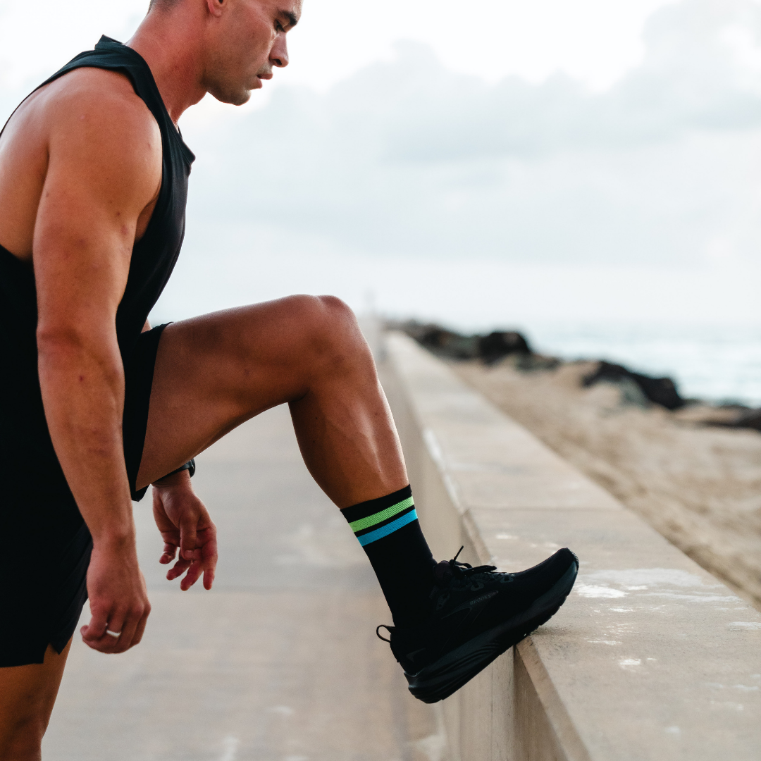 Image of person wearing Lightfeet Performance 2 Stripes Black Yellow Aqua Crew Socks 