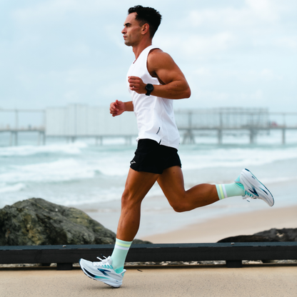 Image of person wearing Lightfeet Performance 2 Stripes Glacier Yellow White Crew Socks 