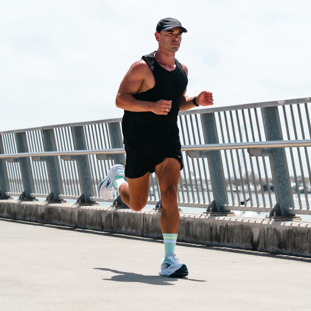Image of person wearing Lightfeet Performance 2 Stripes Glacier Yellow White Crew Socks 