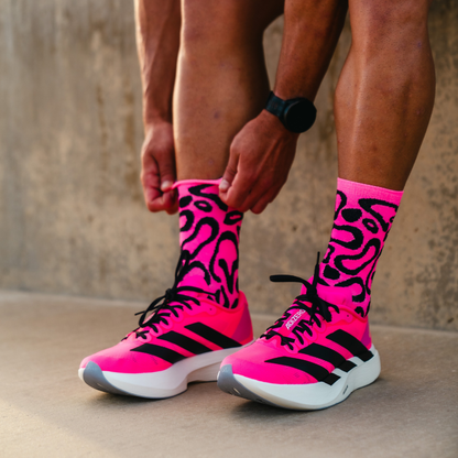 Image of person wearing Lightfeet Performance Scribbles Pink Black Crew Socks 