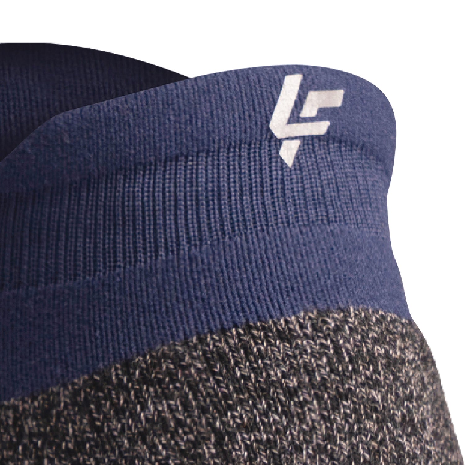 Close up view of reflective symbol on Lightfeet Performance Navy Ankle Sock 