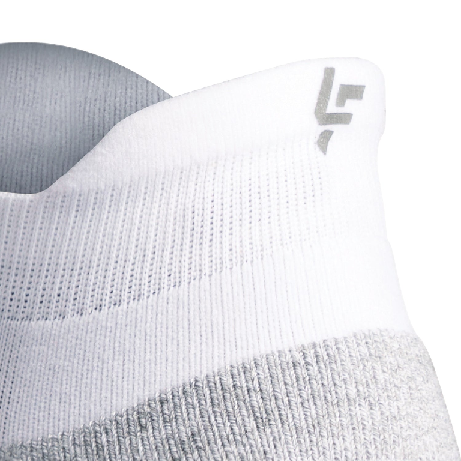 Close up view of reflective symbol on Lightfeet Performance White Ankle Sock 