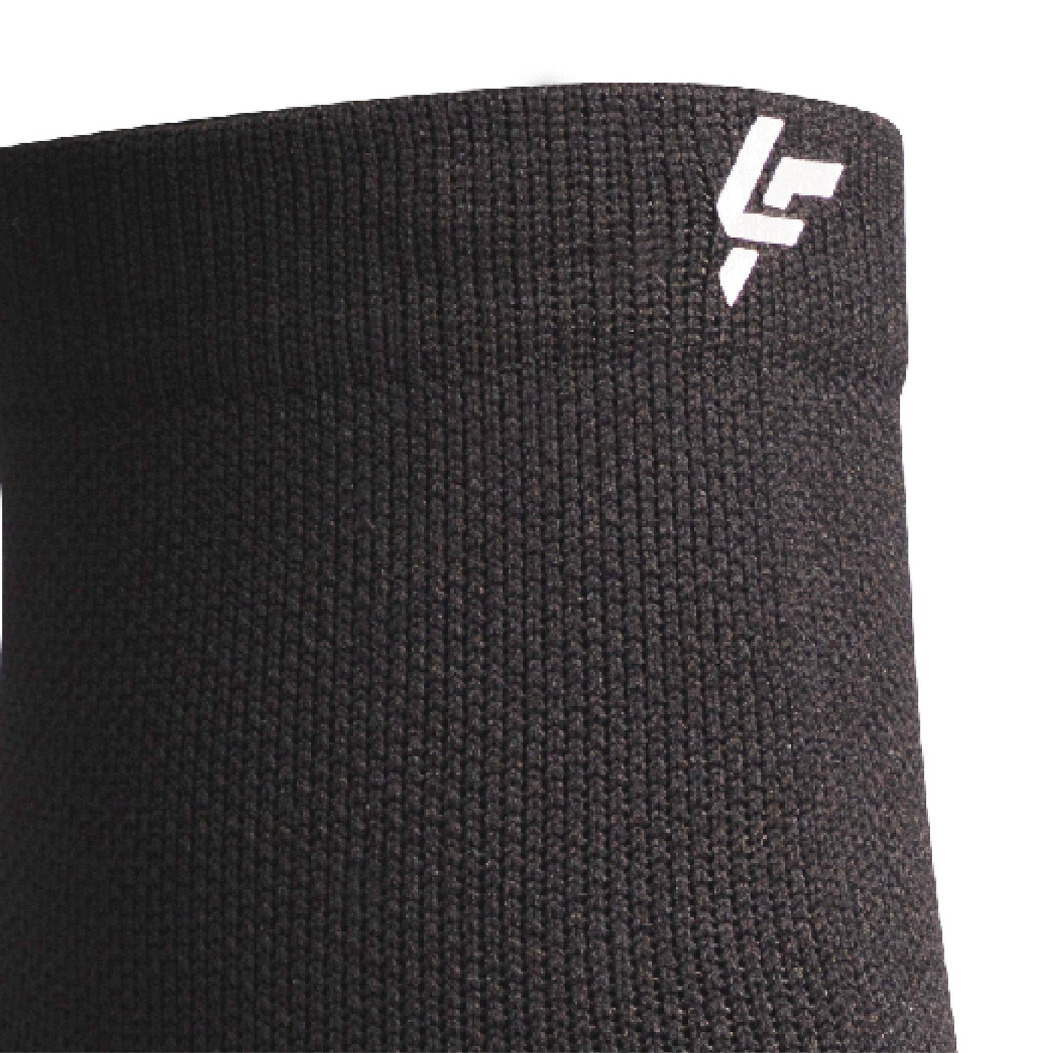 Close up view of reflective symbol on Lightfeet Performance Black Quarter Crew Sock 