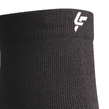 Close up view of reflective symbol on Lightfeet Performance Black Quarter Crew Sock 