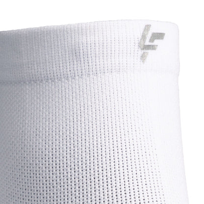 Close up view of reflective symbol on Lightfeet Performance White Quarter Crew Sock 